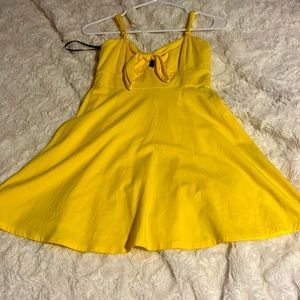 I’m selling a beachy beautiful yellow sun dress